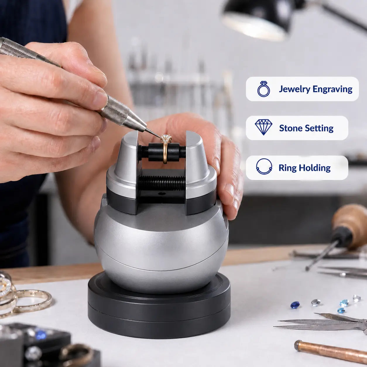 Jeweler using Musttool 5-inch ball vise to engrave a ring at the workbench, with callouts for jewelry engraving, stone setting, and ring holding applications